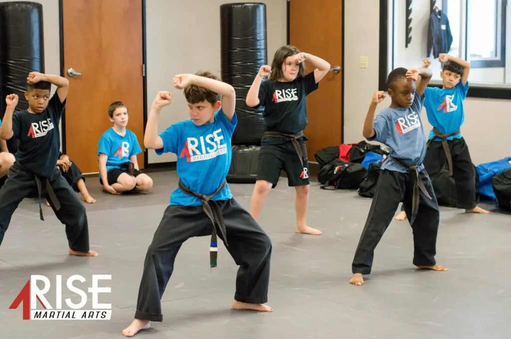 Kids practicing karate techniques during class in Pflugerville
