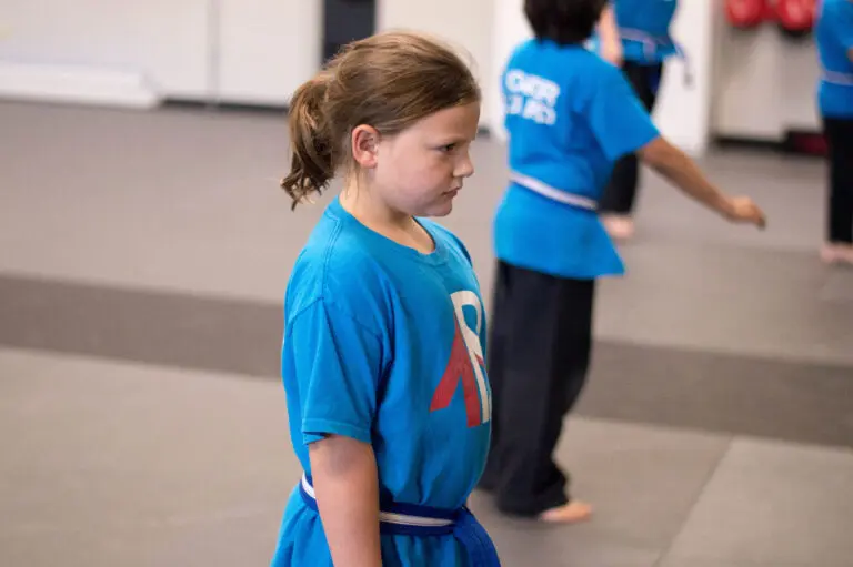 Group of children learning discipline in Pflugerville martial arts program